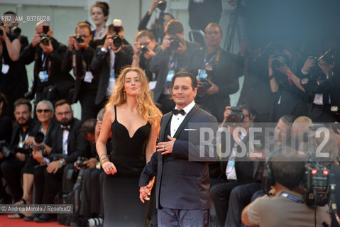 US actor/cast member Johnny Depp (R) and his wife US actress Amber Heard, arrive for the premiere of Black Mass, by Us director Scott Cooper, at the 72nd annual Venice International Film Festival, in Venice, Italy, 04 September 2015. .L’attore statunitense Johnny Depp e l’attrice Amber Heard sul red carpet della Mostra Internazionale d’Arte Cinematografica edizione 72, per prsentare il film “Black Mass”, diretto dal regiata statunitense Scott Cooper, Venezia  4 settembre 2015.... ©Andrea Merola/Rosebud2