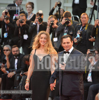 US actor/cast member Johnny Depp (R) and his wife US actress Amber Heard, arrive for the premiere of Black Mass, by Us director Scott Cooper, at the 72nd annual Venice International Film Festival, in Venice, Italy, 04 September 2015. .L’attore statunitense Johnny Depp e l’attrice Amber Heard sul red carpet della Mostra Internazionale d’Arte Cinematografica edizione 72, per prsentare il film “Black Mass”, diretto dal regiata statunitense Scott Cooper, Venezia  4 settembre 2015.... ©Andrea Merola/Rosebud2