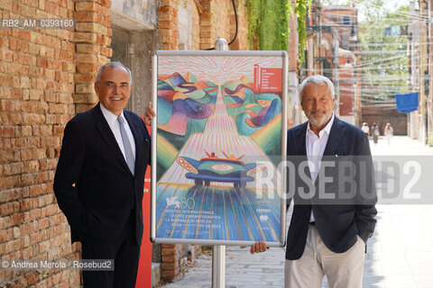 Da sx a dx: il direttore del settore Cinema della Biennale Alberto Barbera e il presidente della Biennale Roberto Cicutto posano accanto il manifesto di Venezia Cinema 80, oggi 25 luglio 2023, al termine della conferenza stampa di presentazione della Mostra Internazionale di Arte Cinematografica 2023, presso la biblioteca ASAC nel sestiere di Castello. ©Andrea Merola/Rosebud2