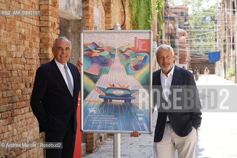 Da sx a dx: il direttore del settore Cinema della Biennale Alberto Barbera e il presidente della Biennale Roberto Cicutto posano accanto il manifesto di Venezia Cinema 80, oggi 25 luglio 2023, al termine della conferenza stampa di presentazione della Mostra Internazionale di Arte Cinematografica 2023, presso la biblioteca ASAC nel sestiere di Castello. ©Andrea Merola/Rosebud2