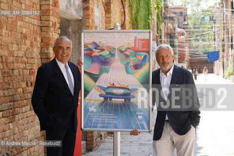 Da sx a dx: il direttore del settore Cinema della Biennale Alberto Barbera e il presidente della Biennale Roberto Cicutto posano accanto il manifesto di Venezia Cinema 80, oggi 25 luglio 2023, al termine della conferenza stampa di presentazione della Mostra Internazionale di Arte Cinematografica 2023, presso la biblioteca ASAC nel sestiere di Castello. ©Andrea Merola/Rosebud2