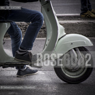 Rome - May 1, 2015 - A boy in jeans on a green Vespa...Roma - 1 maggio 2015 - Un ragazzo in jeans a bordo di una vespa Verde. ©Sebastiano Vianello/Rosebud2