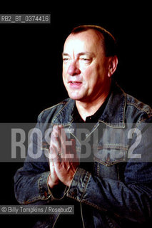 Neil Ellwood Peart, born September 12, 1952), is a Canadian-American author and retired musician, best known as the drummer and primary lyricist for the rock band Rush. Peart has received numerous awards for his musical performances, including an induction into the Modern Drummer Hall of Fame in 1983, making him the youngest person ever so honoured. His drumming is known for its technical proficiency and his live performances are known for their exacting nature and stamina..Peart is the author of seven non-fiction books, the latest released in September 2016. His growth as an author predates the published work by several years (not including his work as Rushs primary lyricist), through private letters and short travelogues sent out to a small circle of friends and family...Pearts first book, titled The Masked Rider: Cycling in West Africa,[57] was written in 1996 about a month-long bicycling tour through Cameroon in November 1988. The book details Pearts travels through towns and villages with four fellow riders. The original had a limited print run, but after the critical and commercial success of Pearts second book, Masked Rider was re-issued and remains in print as of 2006...After losing his wife and (at the time) only daughter, Peart embarked on a lengthy motorcycle road trip spanning North America. His experiences were penned in Ghost Rider: Travels on the Healing Road.[23] Peart and the rest of the band were always able to keep his private life at a distance from his public image in Rush. However, Ghost Rider is a first-person narrative of Peart on the road, on a BMW R1100GS motorcycle, in an effort to put his life back together as he embarked on an extensive journey across North America...Years later, after his marriage to Nuttall, Peart took another road trip, this time by car. In his third book, Traveling Music: Playing Back the Soundtrack to My Life and Times,[73] he reflects on his life, his career, his family and music. As with his previous two books, it is a first-person narrative...Thirty years after Peart joined Rush, the band found itself on its 30th anniversary tour. Released in September 2006, Roadshow: Landscape With Drums, A Concert Tour By Motorcycle details the tour both from behind Neils drumkit and on his BMW R1150GS and R1200GS motorcycles...Pearts next book, Far and Away: A Prize Every Time, was published by ECW Press in May 2011.[74] This book, which he worked on for two years, is based around his traveling in North and South America. It tells how he found in a Brazilian town a unique combination of West African and Brazilian music.[75] In 2014, a follow-up book, Far and Near: On Days like These, was published by ECW. It covers travels in North America and Europe.[76] Another book, Far and Wide: Bring That Horizon to Me!, was published in 2016 and is based on his travels between stops on the R40 Live Tour of 2015...Peart worked with science fiction author Kevin J. Anderson to develop a novelization of Rushs 2012 album Clockwork Angels; the book was published by ECW Press.[77] Snippets of the bands lyrics can be found throughout the story. The two collaborated again on a loose sequel, Clockwork Lives, published in 2015. ©Billy Tompkins/Rosebud2