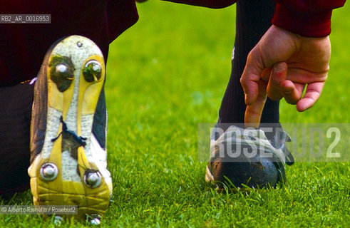 OFFSIDE (behind the scenes of soccer heaven).in the reportage you can see what youll never see on television.  A trip inside the secrets of the professional world of soccer where  actors are not only the players. 2000-2008.in the picture: player stretching before the match ©Alberto Ramella/Rosebud2