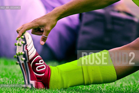 OFFSIDE (behind the scenes of soccer heaven).in the reportage you can see what youll never see on television.  A trip inside the secrets of the professional world of soccer where  actors are not only the players. 2000-2008.in the picture: player stretching before the match ©Alberto Ramella/Rosebud2