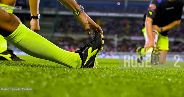 OFFSIDE (behind the scenes of soccer heaven).in the reportage you can see what youll never see on television.  A trip inside the secrets of the professional world of soccer where  actors are not only the players. 2000-2008.in the picture: player stretching before the match ©Alberto Ramella/Rosebud2