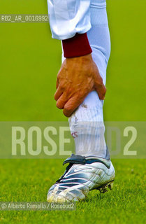 OFFSIDE (behind the scenes of soccer heaven).in the reportage you can see what youll never see on television.  A trip inside the secrets of the professional world of soccer where  actors are not only the players. 2000-2008.in the picture: player stretching before the match ©Alberto Ramella/Rosebud2