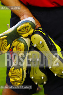 OFFSIDE (behind the scenes of soccer heaven).in the reportage you can see what youll never see on television.  A trip inside the secrets of the professional world of soccer where  actors are not only the players. 2000-2008.in the picture: preparing shoes for the match in parma tardini stadium ©Alberto Ramella/Rosebud2