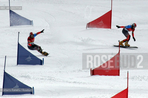 two brothers from switzerland philip and simon schoch won gold and silver medal, bronze for austrian siegfried grabner in snowboard psg, bardonecchia- in the pict the winner philip schoch agaiunst brother simon on course ©Alberto Ramella/Rosebud2