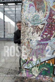 Douglas Kennedy in Berlin with part of the wall at Postdamer Platz. Berlin, September 8, 2011 - ©Ulf Andersen/Rosebud2