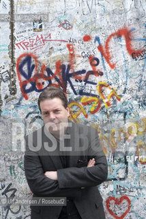 Douglas Kennedy in Berlin with part of the wall at Postdamer Platz. Berlin, September 8, 2011 - ©Ulf Andersen/Rosebud2