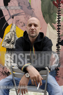 Russian writer Zakhar Prilepine with a painting from Fiona Valentine Thomann. Lyon, May 31, 2012 - ©Ulf Andersen/Rosebud2