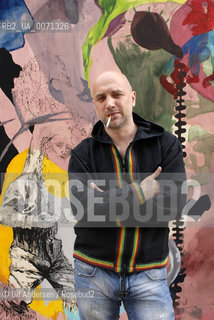 Russian writer Zakhar Prilepine with a painting from Fiona Valentine Thomann. Lyon, May 31, 2012 - ©Ulf Andersen/Rosebud2