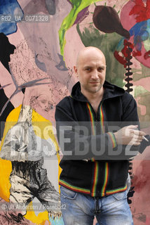 Russian writer Zakhar Prilepine with a painting from Fiona Valentine Thomann. Lyon, May 31, 2012 - ©Ulf Andersen/Rosebud2